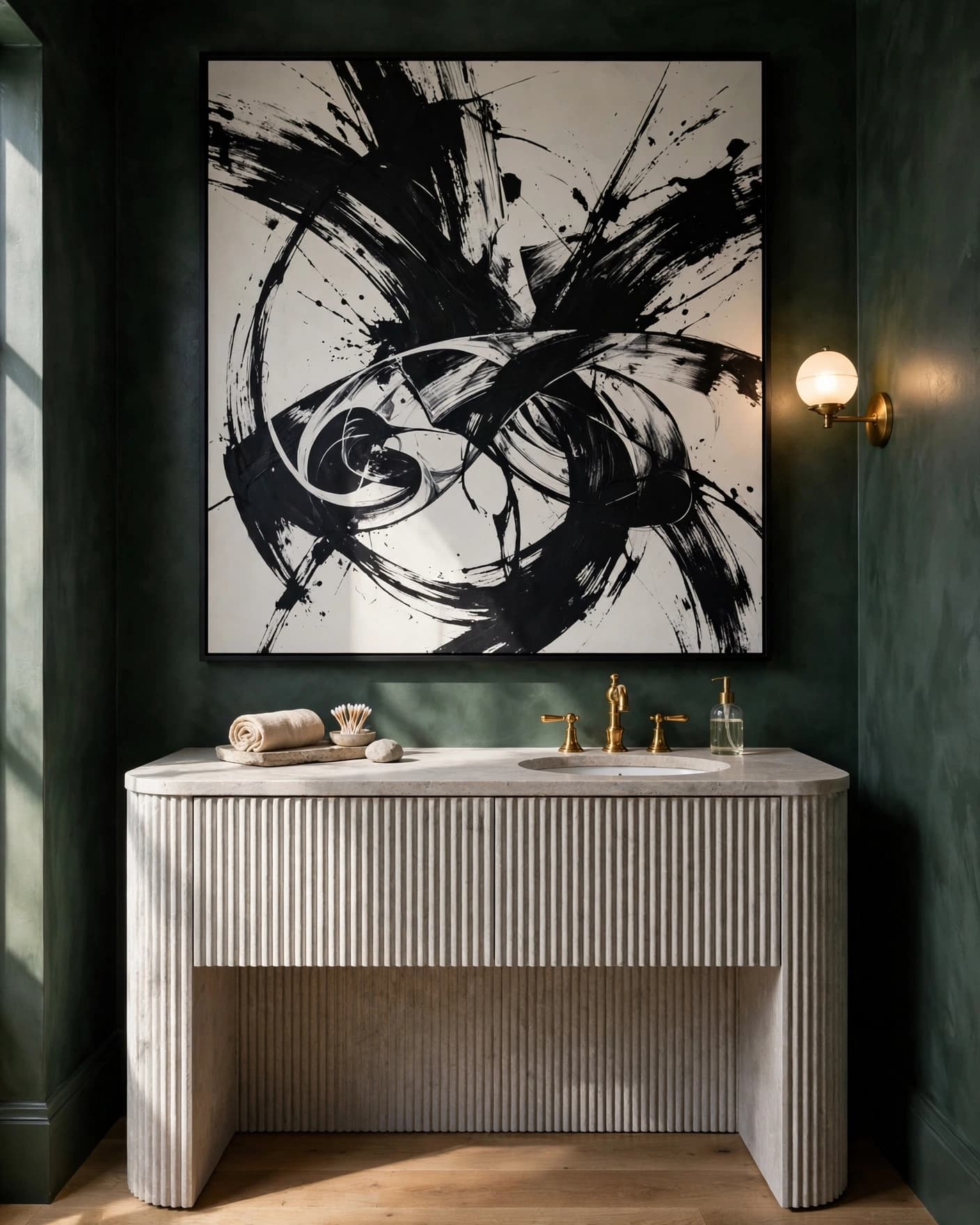 A dark green powder room with a stone vanity and large black-and-white artwork.